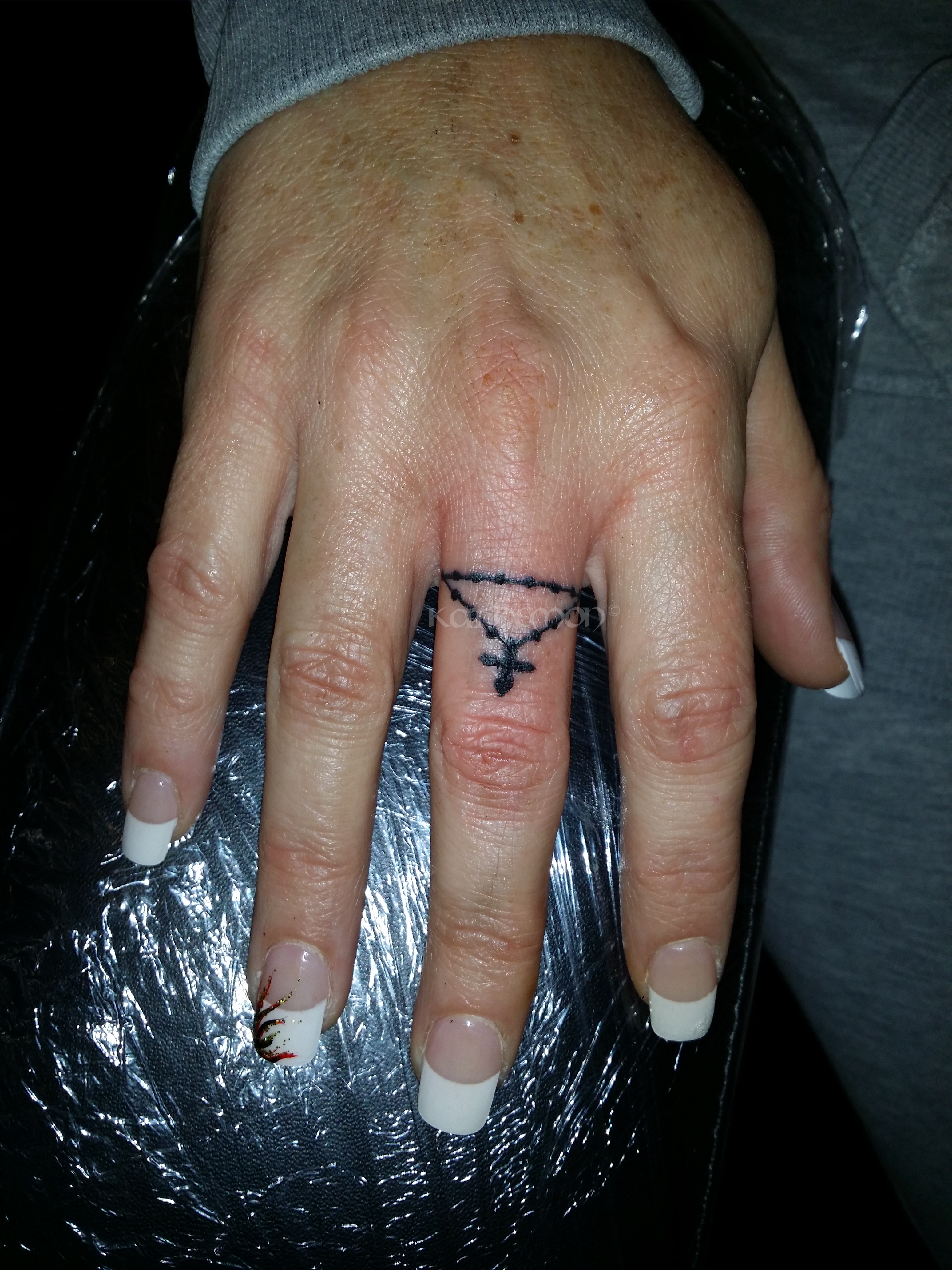 rosary finger tattoo